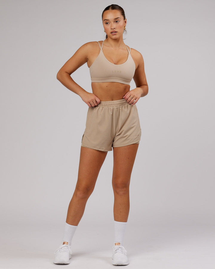 Woman wearing Challenger Run Short - Taupe