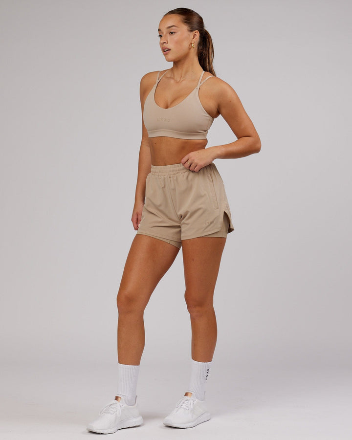 Woman wearing Challenger Run Short - Taupe