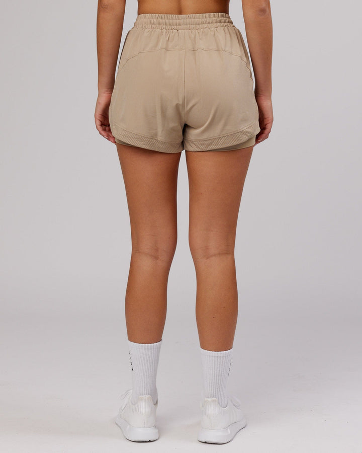 Woman wearing Challenger Run Short - Taupe