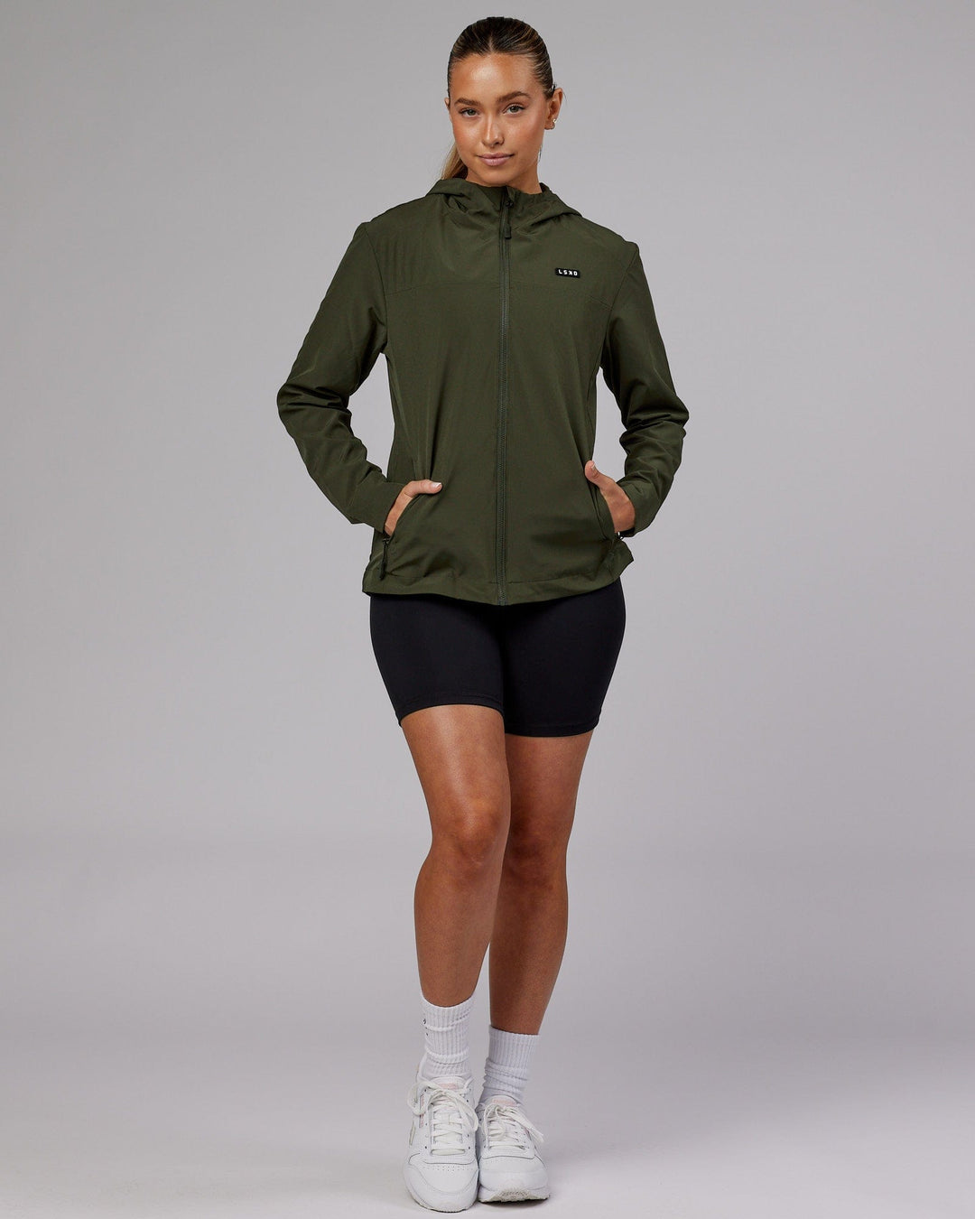 Woman wearing Womens Functional Training Jacket - Forest Night