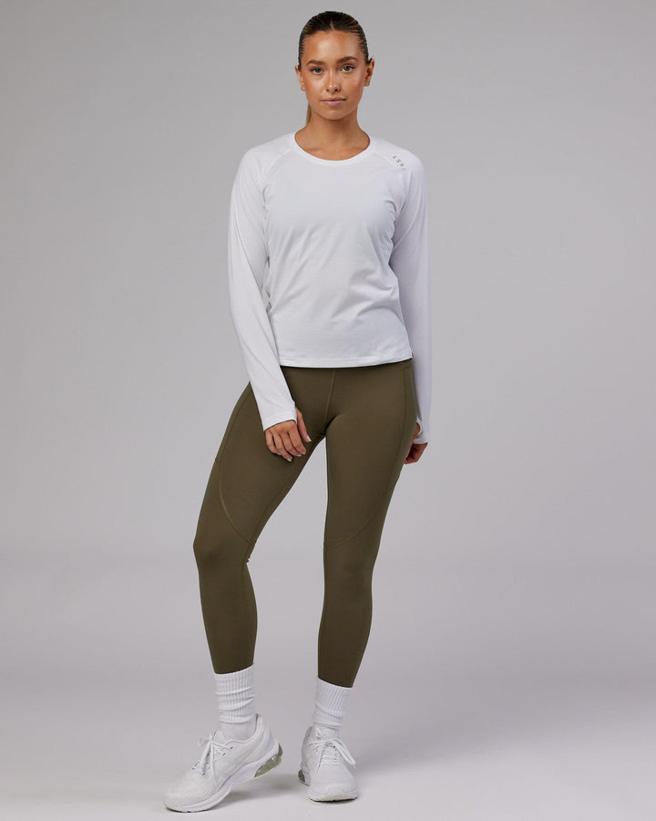 Woman wearing Perform VapourFLX LS Tee - White Marl