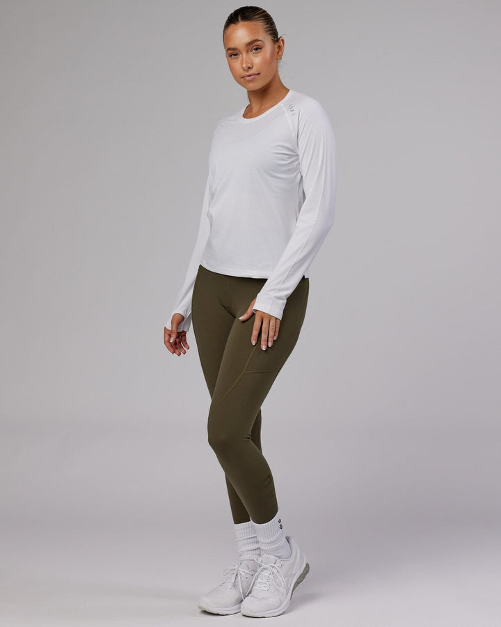 Woman wearing Perform VapourFLX LS Tee - White Marl