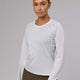 Woman wearing Perform VapourFLX LS Tee - White Marl