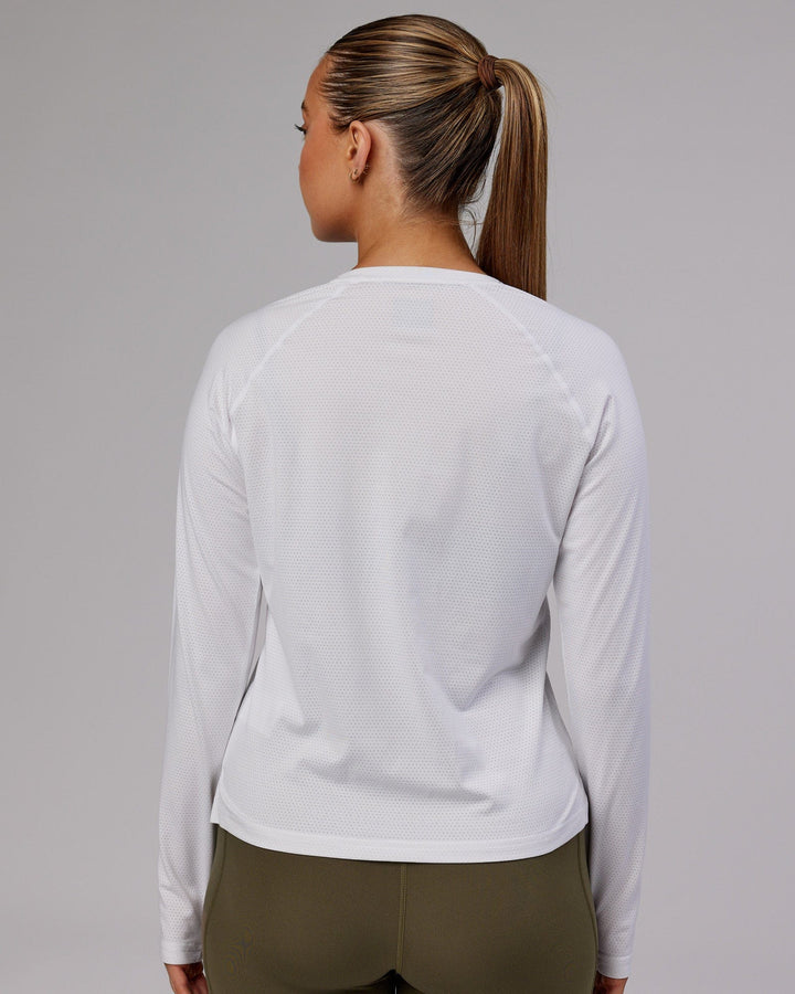 Woman wearing Perform VapourFLX LS Tee - White Marl