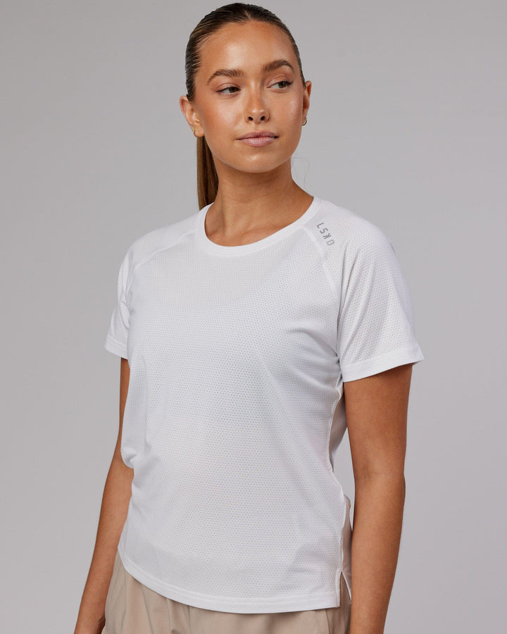 Woman wearing Perform VapourFLX Tee - White Marl