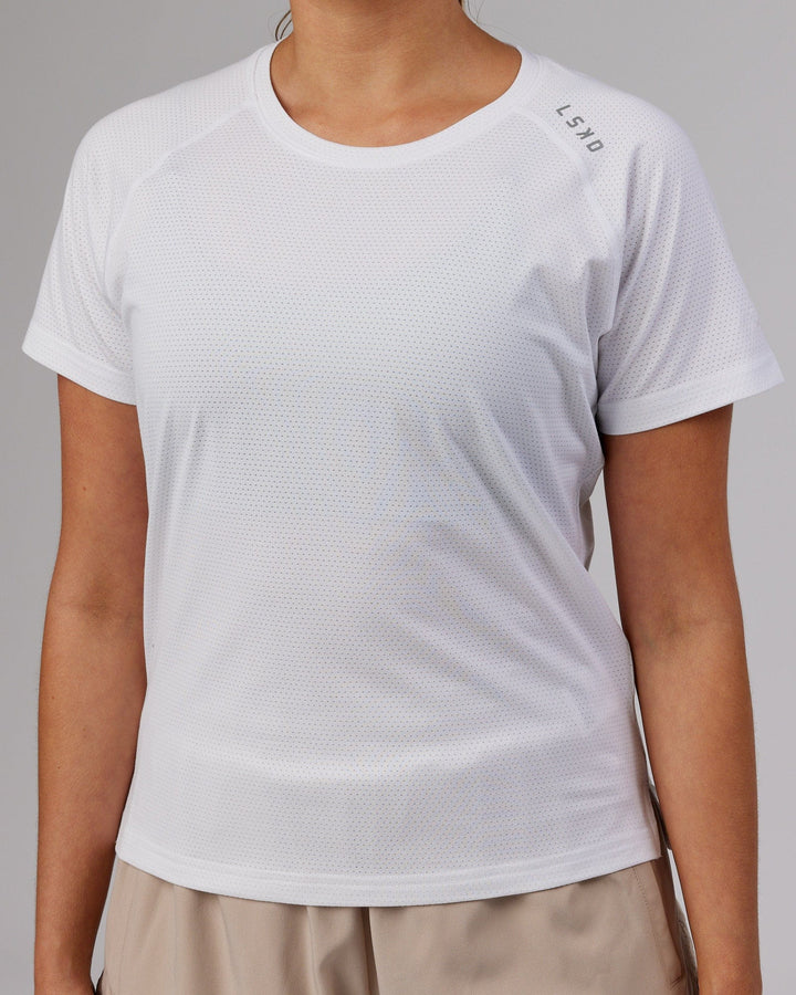 Woman wearing Perform VapourFLX Tee - White Marl