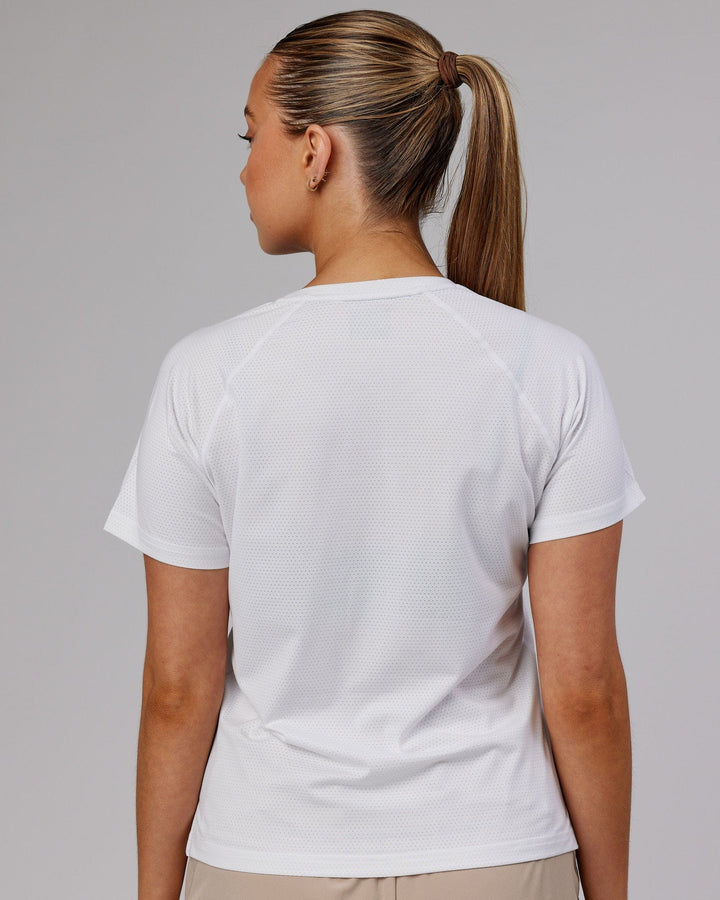 Woman wearing Perform VapourFLX Tee - White Marl