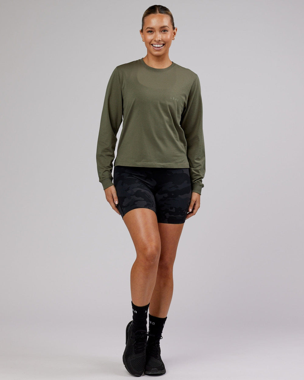 Woman wearing PimaFLX LS Tee - Olive Fade