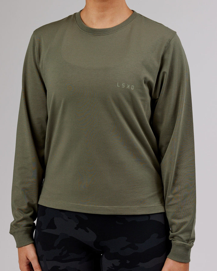 Woman wearing PimaFLX LS Tee - Olive Fade