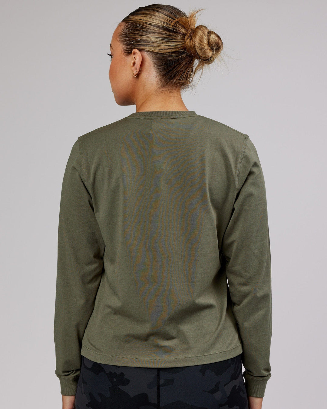 Woman wearing PimaFLX LS Tee - Olive Fade