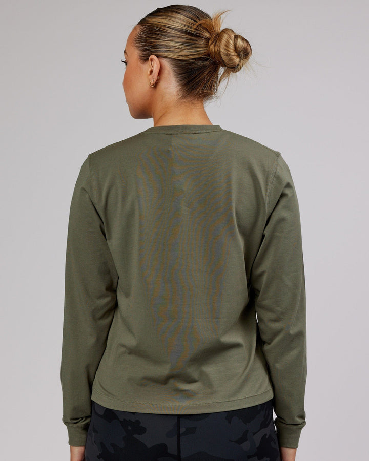 Woman wearing PimaFLX LS Tee - Olive Fade
