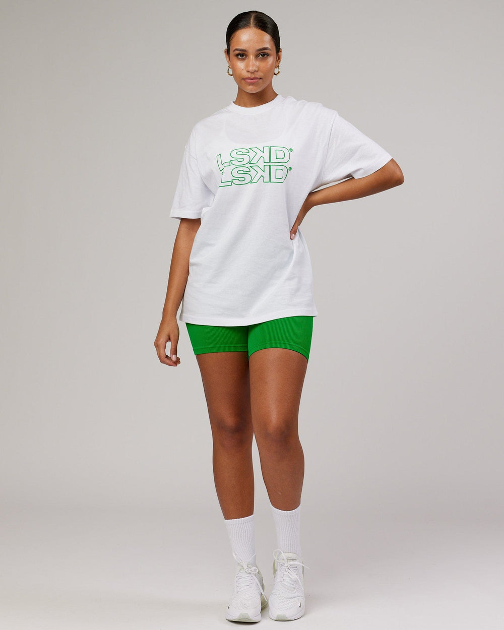 Woman wearing Unisex Stacks Up Heavyweight Tee - White-Vivid Green