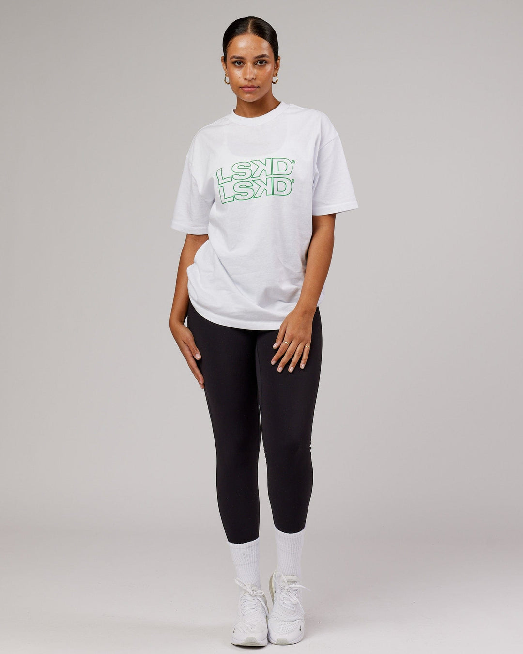 Woman wearing Unisex Stacks Up Heavyweight Tee - White-Vivid Green
