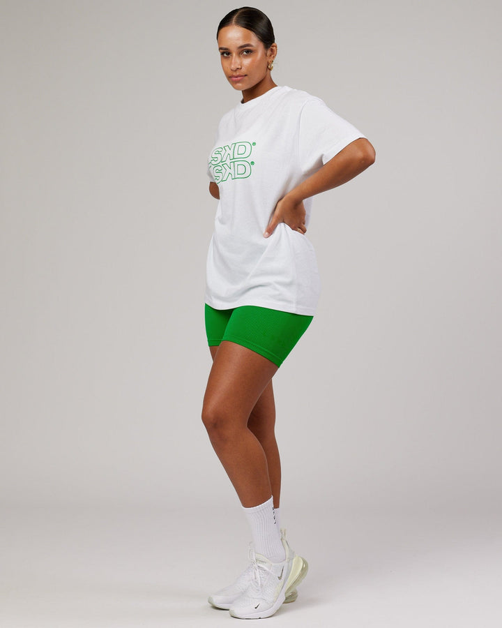 Woman wearing Unisex Stacks Up Heavyweight Tee - White-Vivid Green
