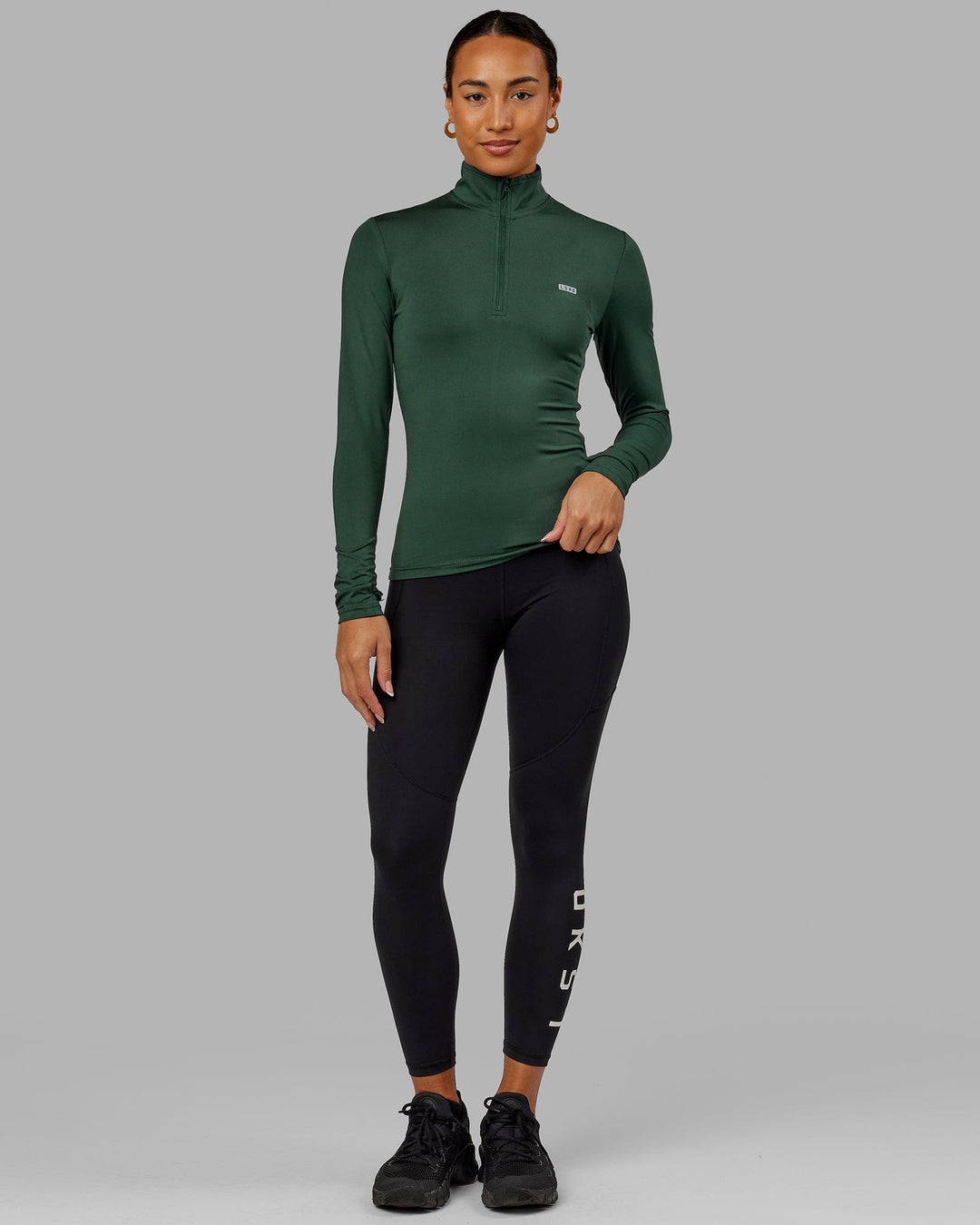 Woman wearing Streamlined 1/4 Zip LS Tee - Vital Green
