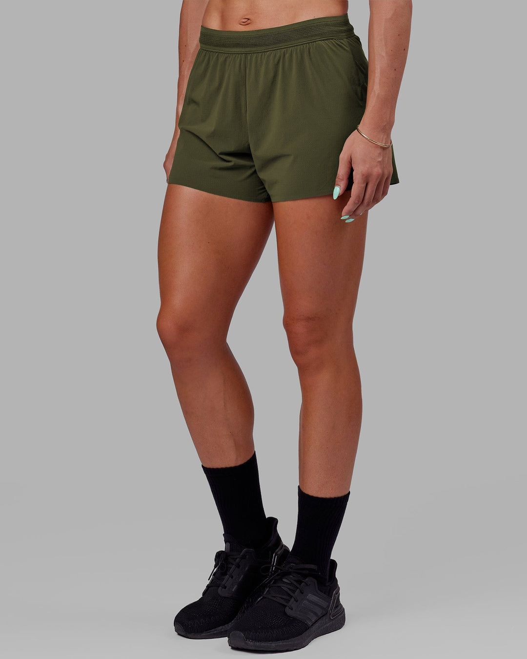 Womanw earing Ultra Air Lined Performance Short - Forest Night