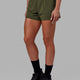 Womanw earing Ultra Air Lined Performance Short - Forest Night