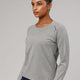 Woman wearing Light Grey Marl Perform VapourLFX Long Sleeve Tee