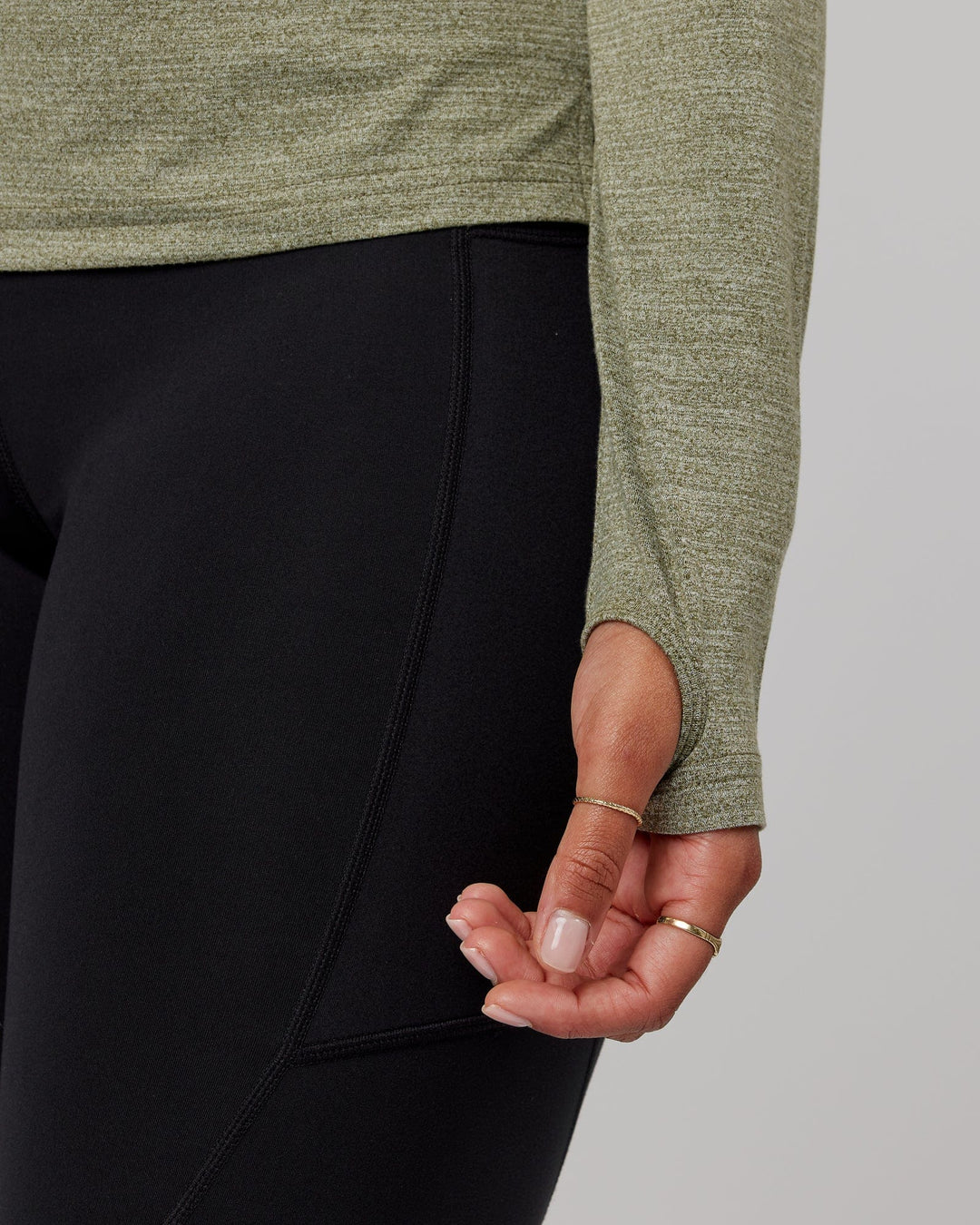 Woman wearing Olive Marl Perform VapourLFX Long Sleeve Tee