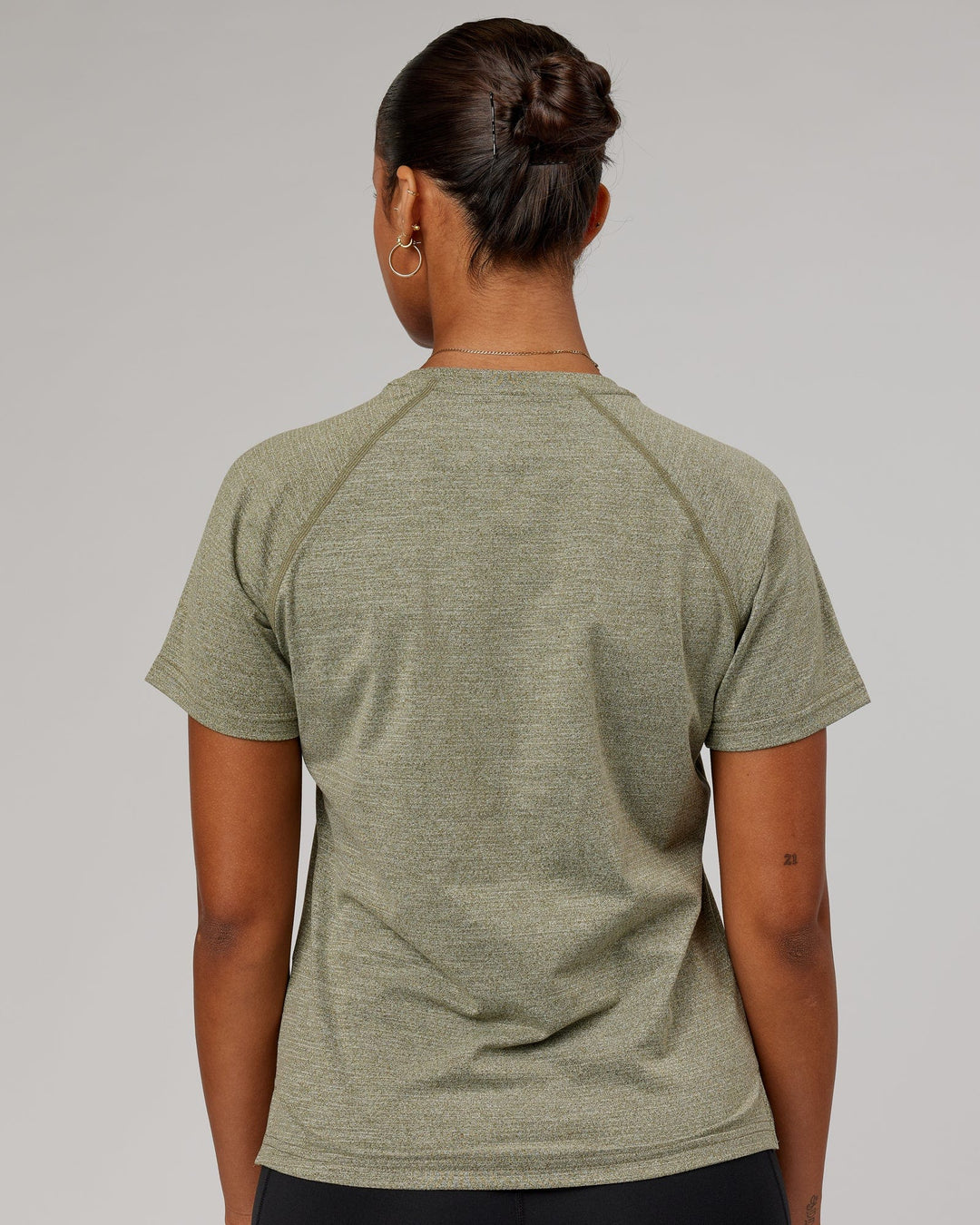 Woman wearing Olive Marl Perform VapourLFX 