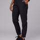 Woman wearing Warm Up Zip Cuff Performance Pant - Black