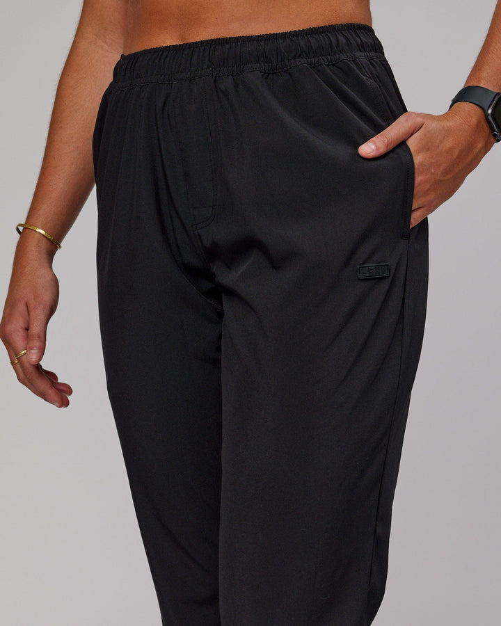 Woman wearing Warm Up Zip Cuff Performance Pant - Black