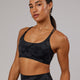 Woman wearing Yin Bra - Black Camo